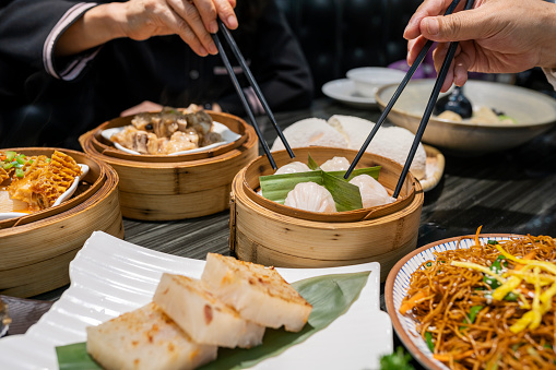 Dum sum including Shrimp Dumpling, Shumai, Honeycomb Tripes, Fried Noodles, Steamed Ribs, Fried Turnip Cake, Peach Gum Egg Tart, Cheesecake in the restaurant in Guangzhou, Guangdong.