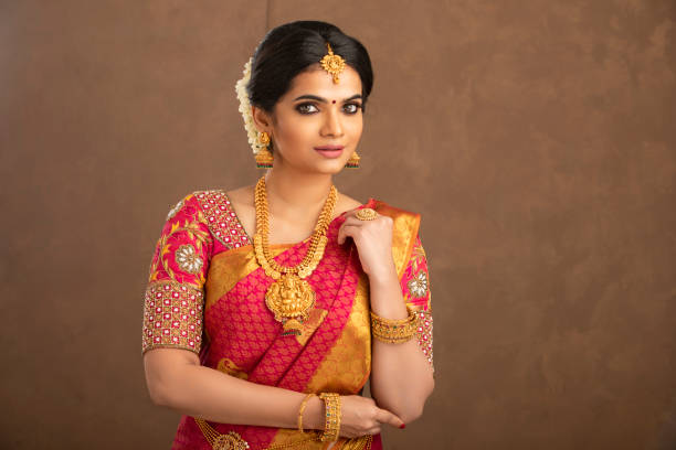 istock Beautiful smiling Indian bride with jewelry in studio shot. 1362095616