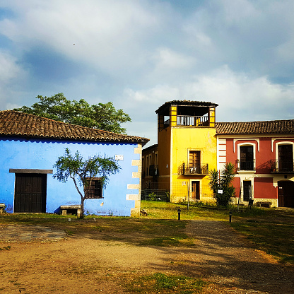 Plaza of the abandoned town of Granadilla, houses of various colors