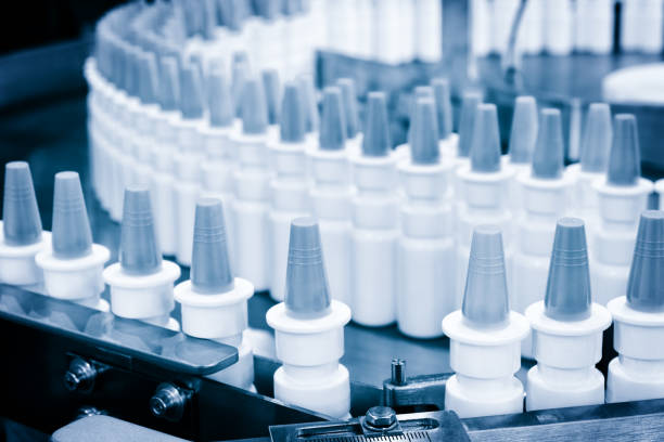 istock Close-up Many white plastic spray bottles for packaging liquid medicines or cosmetics in a row on a conveyor belt in a pharmaceutical manufacturing factory 1362102673