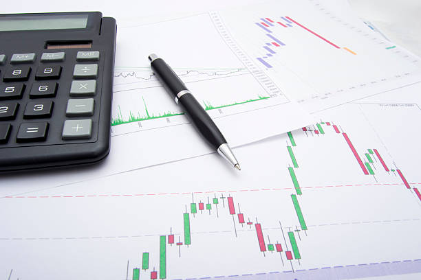 istock Candlestick Chart of a Company With Pen 136210568