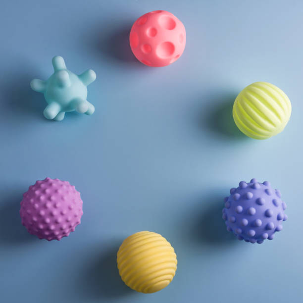 Sensory balls for kids, textured plastic multi ball set for babies and toddlers, colorful soft squeezy sensory toys to enhance cognitive and physical processes of children. Free space for text. bolas sensoriales para niños, juego de bolas múltiples de plástico texturizado para bebés y niños pequeños, coloridos juguetes sensoriales suaves y exprimidos para mejorar los procesos cognitivos y físicos de los niños. espacio libre para texto
