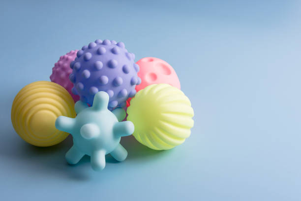 Sensory balls for kids, textured plastic multi ball set for babies and toddlers, colorful soft squeezy sensory toys to enhance cognitive and physical processes of children. Free space for text. bolas sensoriales para niños, juego de bolas múltiples de plástico texturizado para bebés y niños pequeños, coloridos juguetes sensoriales suaves y exprimidos para mejorar los procesos cognitivos y físicos de los niños. espacio libre para texto