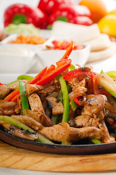 istock original fajita sizzling hot  on iron plate 136211108