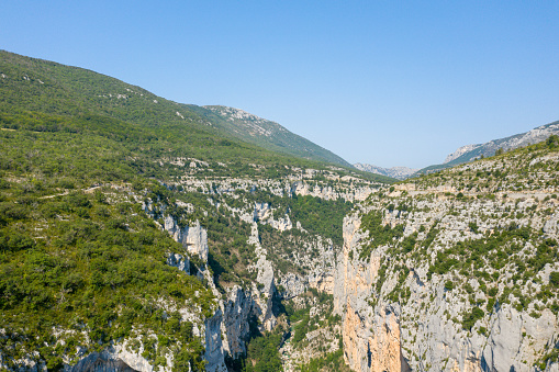 This landscape photo was taken in Europe, in France, Provence Alpes Cote d'Azur, in the Var, in summer. We see the panoramic view of the Gorges du Verdon in the middle of the huge forests, under the Sun.