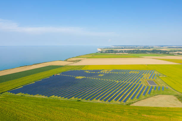 The Norman Solar Panels in the middle of the flax fields towards Veules les Roses in Europe, France, Normandy, summer, on a sunny day. stock photo
