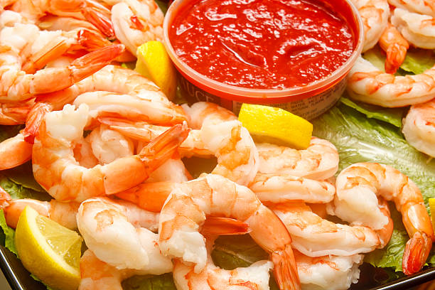istock Jumbo Cooked Shrimp with Cocktail Sauce and Lemon Wedges 136211849