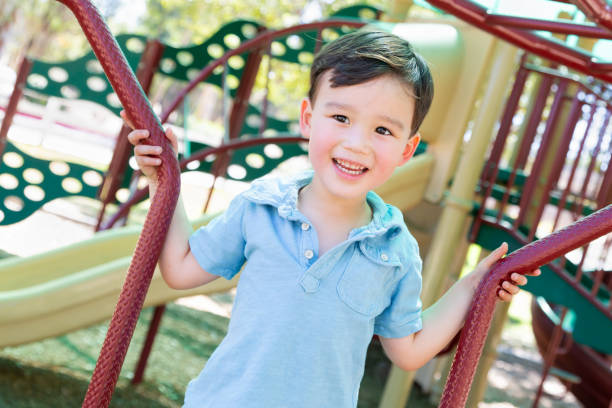istock Chinese and Caucasian Boy Having Fun At The Playground. 1362128582
