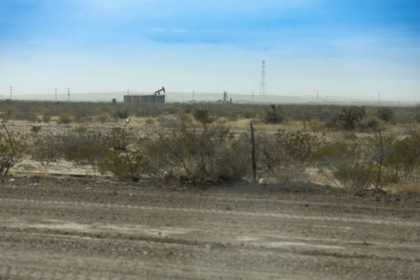 Pumping Jacks operate in the Permian Basin of West Texas near the community of Orla, Texas. Pumping Jacks operate in the Permian Basin of West Texas near the community of Orla, Texas. carlsbad texas stock pictures, royalty-free photos & images