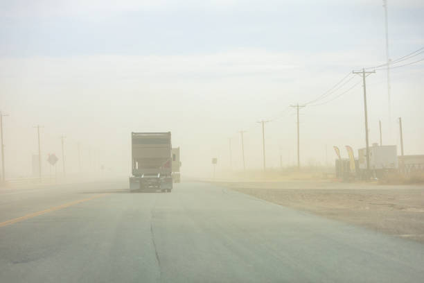 A truck drives through a sand storm near the community of Orla in Reeves County, Texas, USA. A truck drives through a sand storm near the community of Orla in Reeves County, Texas, USA. carlsbad texas stock pictures, royalty-free photos & images