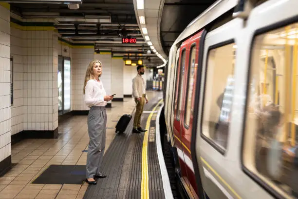 Photo of Commuters waiting on underground platform for transportation