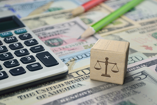 Law flat icon on wooden block cube with calculator and pencil on dollar bank note money, Business legal service concept