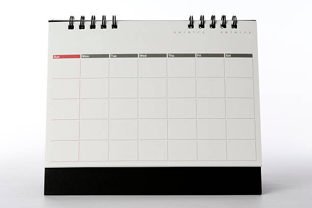 Blank desktop calendar isolated on white background. - add your own design or text.