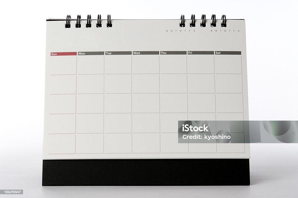 Isolated shot of blank desktop calendar on white background Blank desktop calendar isolated on white background. - add your own design or text. Calendar Stock Photo