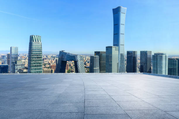 Panoramic skyline and modern commercial office buildings with empty square floors in Beijing, China.