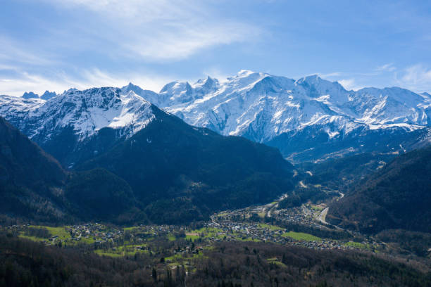 The mountain town Les Houches in the Mont Blanc massif in Europe, in France, in the Alps, towards Chamonix, in spring, on a sunny day. stock photo