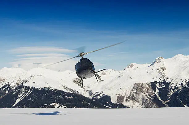Mountain rescue helicopter in flight, Courchevel, France