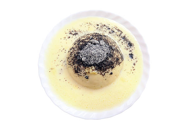 Germknoedel is typical Austrian food. its a fluffy yeast dough dumpling with a mix of poppy seeds and sugar, filled with jam and eaten with vanilla cream.