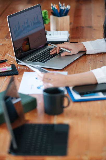 istock Female freelancer working at home sitting at desk using laptop computer. Doing planning analyzing the financial report. 1362178223