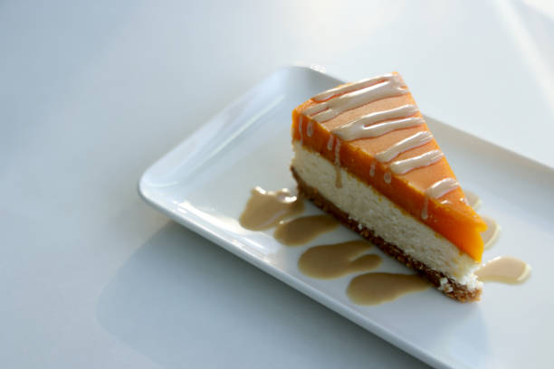 istock Piece of cheesecake with pumpkin jelly 1362189598