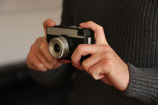 Man holding a retro camera