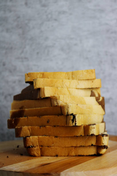 istock a bunch of slices bread on wooden table 1362191033