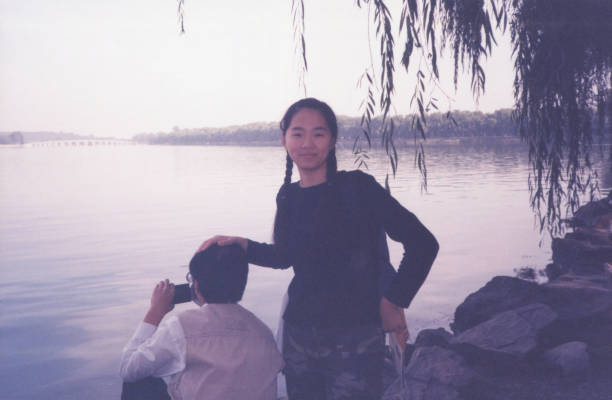 2000s China Young Girl and Father Photo of Real Life 2000s China Young Girl and Father Photo of Real Life lakeshore photos stock pictures, royalty-free photos & images
