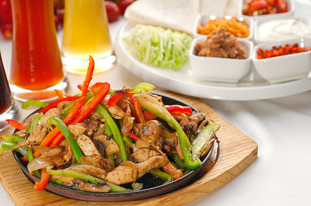 istock original fajita sizzling hot  on iron plate 136219614