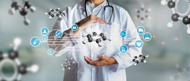 Doctor holding a carbon atom in concept of science and innovation. Medical future technology and innovative concept. stock photo