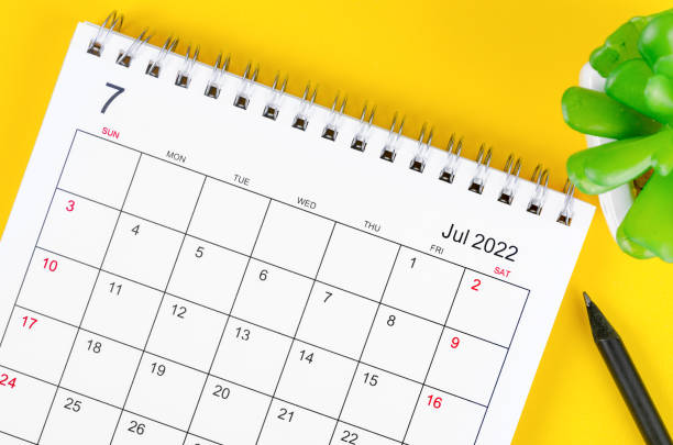 istock July 2022 desk calendar on yellow background. 1362211808
