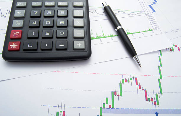 istock Candlestick Chart of a Company With Pen 136221382