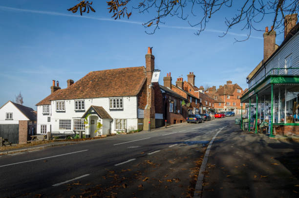 Ightham in Kent, England, with a car and driver visible.