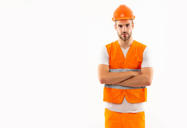 istock man in orange reflective vest and helmet isolated on white background with copy space, supervisor 1362214321