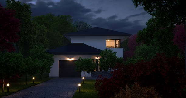 Modern Family House (Night) Digitally generated driveway with a modern family villa/house in the back with deciduous trees in the foreground and the background.

The scene was created in Autodesk® 3ds Max 2022 with V-Ray 5 and rendered with photorealistic shaders and lighting in Chaos® Vantage with some post-production added. blue hour twilight stock pictures, royalty-free photos & images