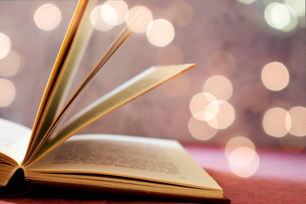 istock Opened book and bokeh lights 1362219187
