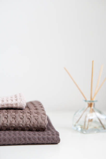istock towels in beige and brown tones on a white background 1362222735
