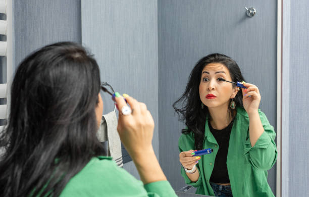 istock Woman applying mascara 1362227657