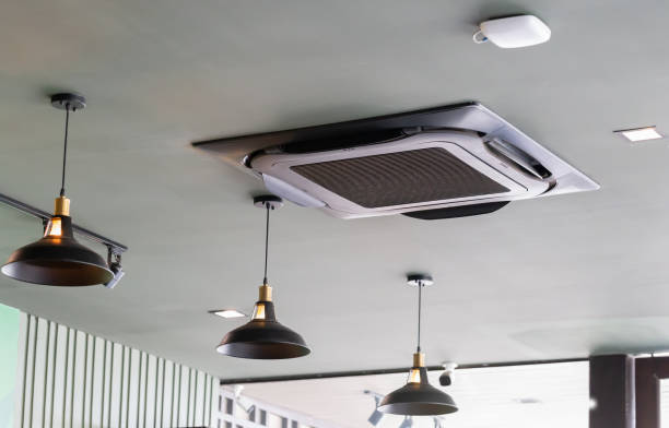 istock Modern ceiling mounted cassette type air conditioning system in coffee shop 1362227784