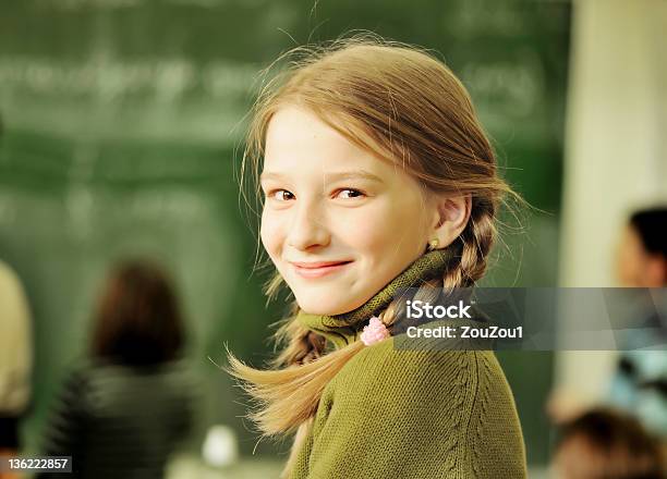 Blond School Girl At Classroom Stock Photo - Download Image Now - Blond Hair, Braided Hair, Cheerful