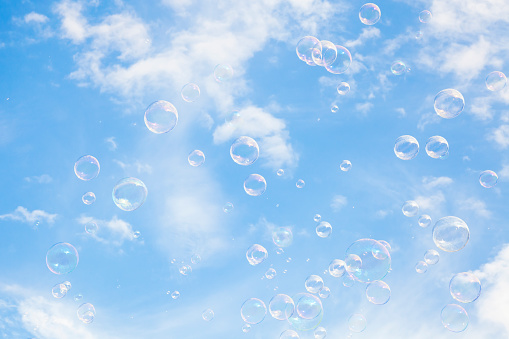 Blue sky and soap bubbles, abstract natural background