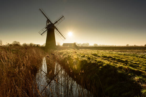 istock St Benet's Mill reflection. Sunrise at St Benet's Mill, Norfolk broads 1362230513