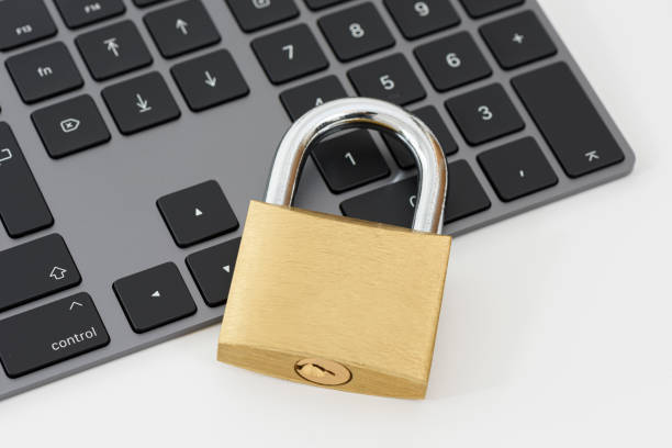 istock Golden metallic lockpad on the black keyboard. 1362232203