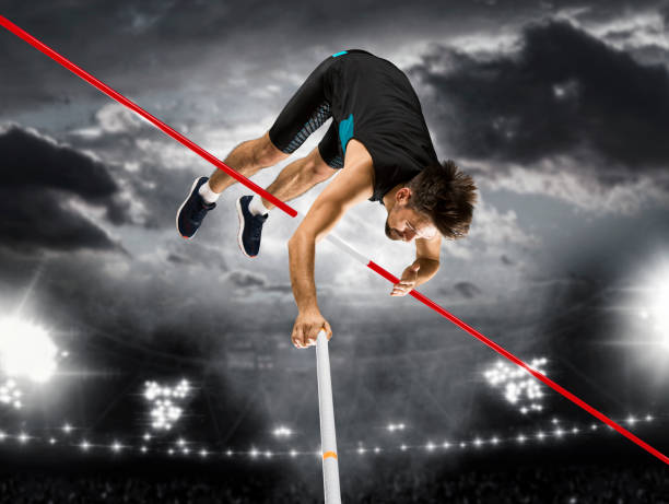 istock Professional pole vaulter training at the stadium at night 1362232413