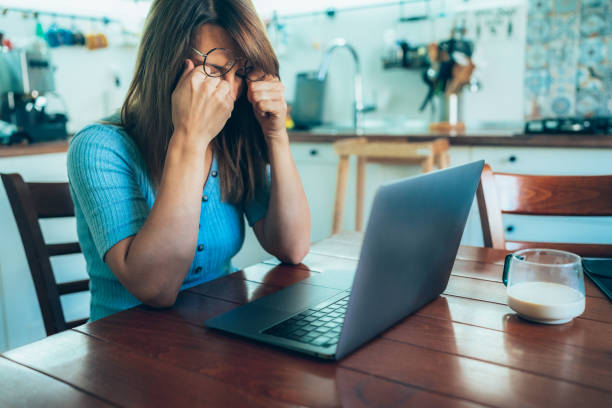 istock Tired woman with headache 1362238372
