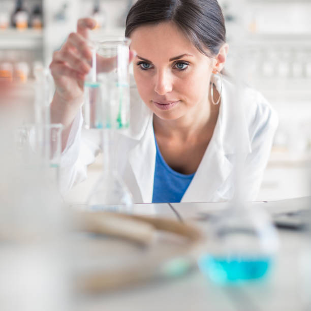 istock Young, female researcher carrying out experiments in a lab 1362239137