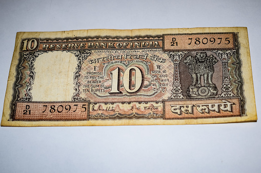 Rare Old Indian Ten rupee currency note on white background, Government of India ten rupee old banknote Indian currency, Old Indian Currency note on the table