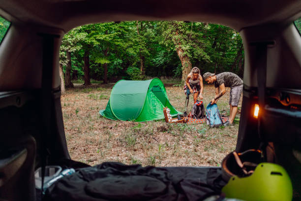 istock Young couple at road trip with car 1362244818