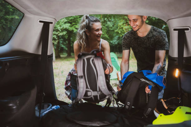 istock Young couple at road trip with car 1362244827