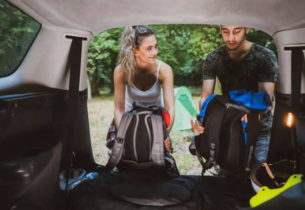 istock Young couple at road trip with car 1362244833