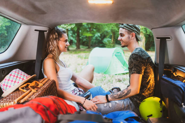 istock Young couple at road trip with car 1362244922